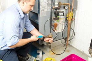 Furnace Technician from 4 Seasons Heating and Air in Alpharetta, GA installing a furnace